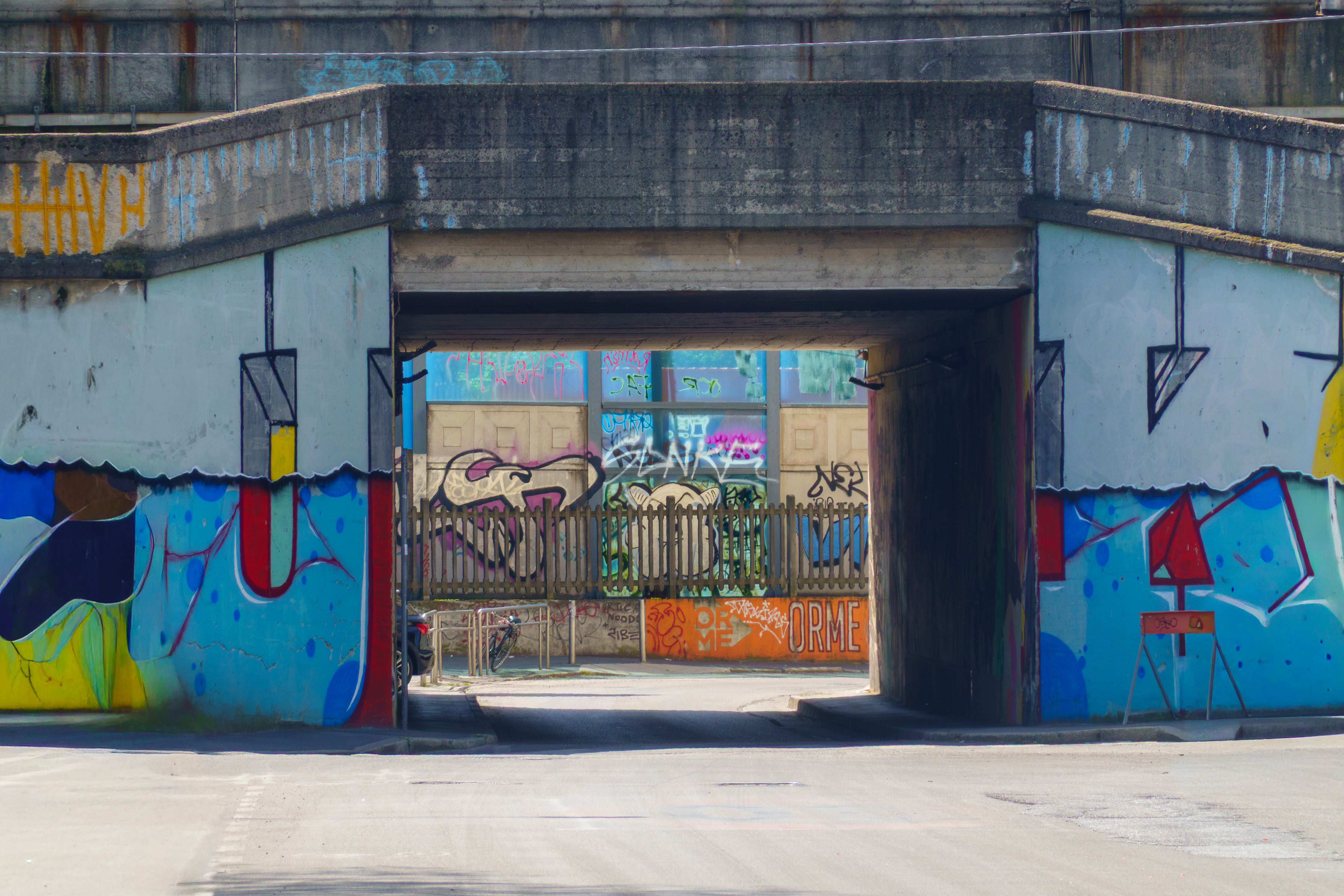 Graffiti covering a concrete underpass wall