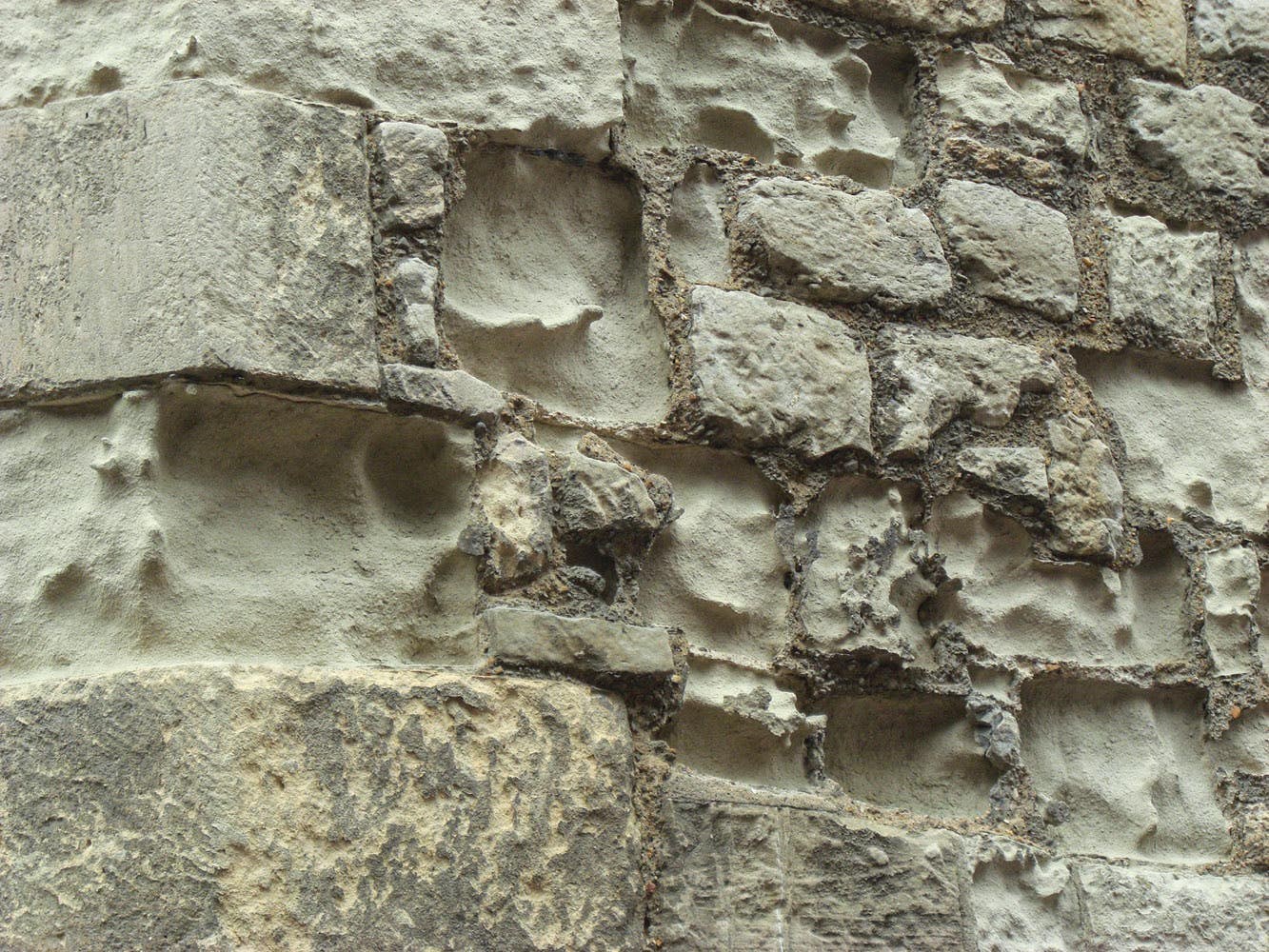 Aged, weathered and stained heritage stone masonry